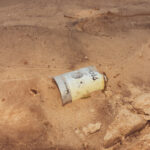 Color photo of Coors beer can from 1977 buried in sand along the Arkansas River near Little Rock, Arkansas