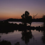 Color photograph of sunset on Arkansas River from Murray Park boat launch in Little Rock, Arkansas