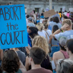 Color photograph of abortion rights protest on the day of the Dobbs decision at State Capitol building in Little Rock, Arkansas