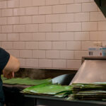 color photograph of woman beginning to make tomorrows tamales at Tamalcalli the Tamale House in downtown Little Rock Arkansas