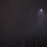 Color photograph of moon through storm clouds on day 10 of last moon of 2022 in Little Rock, Arkansas.