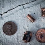 color photograph of pennies and bullets found on a run in downtown little rock, arkansas